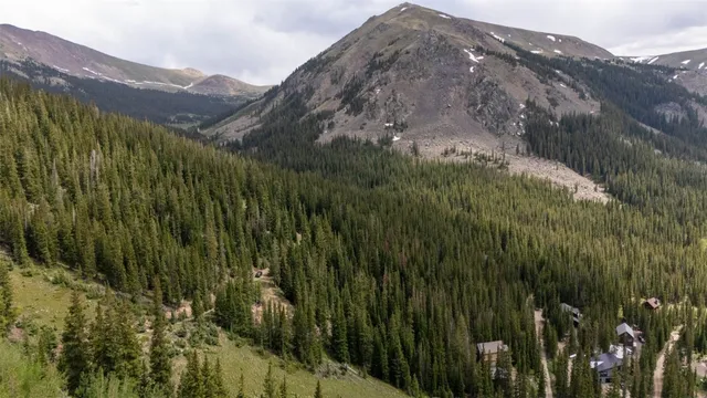 a view of a house with a mountain in the background