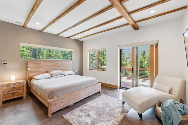 a bedroom with a bed and a couch