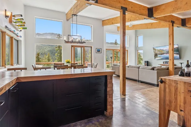 a bathroom with a sink double vanity and a large window