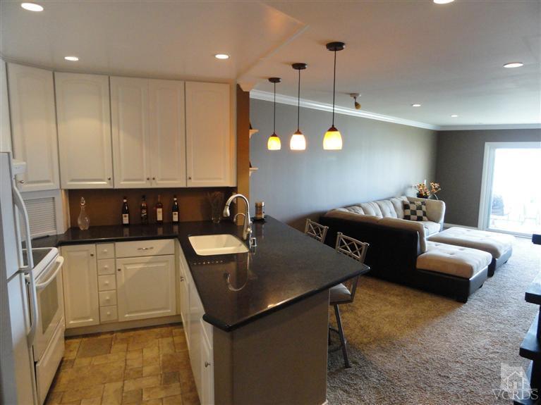 2901 Peninsula Road, Unit 247 Oxnard, CA 93035 - Photo 8 of 30 a kitchen with a sink appliances and cabinets
