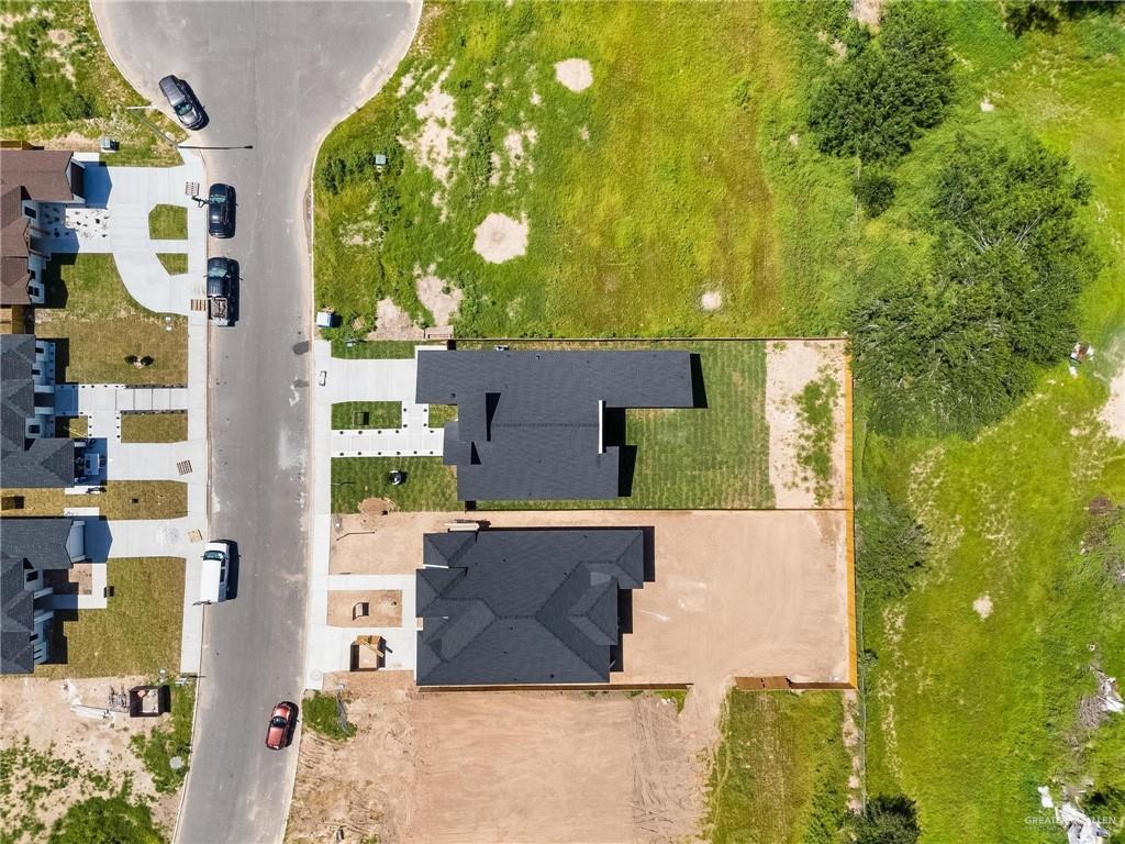 505 Freedom Way Weslaco, TX 78596 - Photo 18 of 20 aerial view of a house with swimming pool and large trees