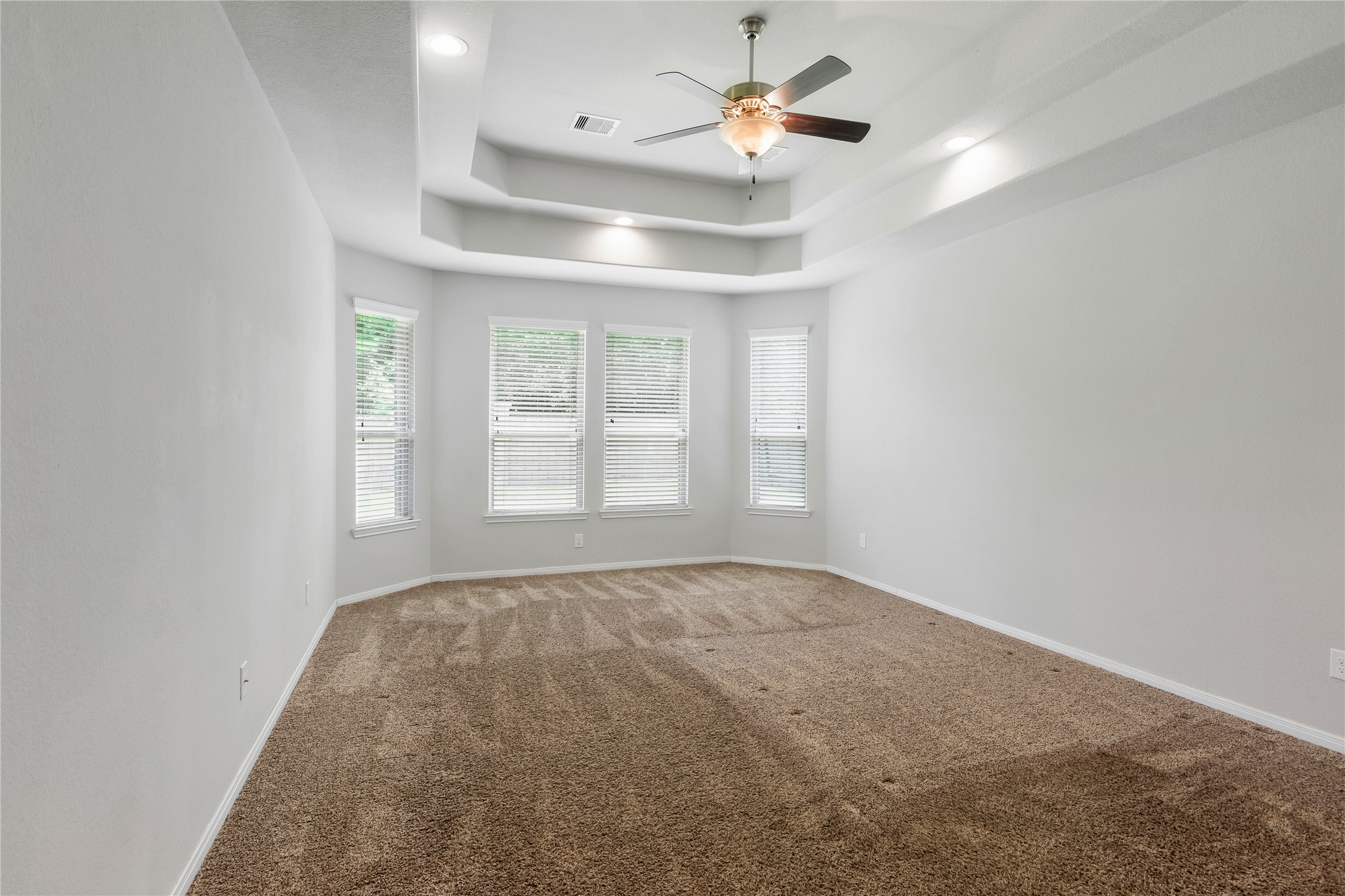 23018 Southern Brk Trail Spring, TX 77389 - Photo 23 of 43 Primary bedroom located downstairs with trey ceilings and beautiful windows.