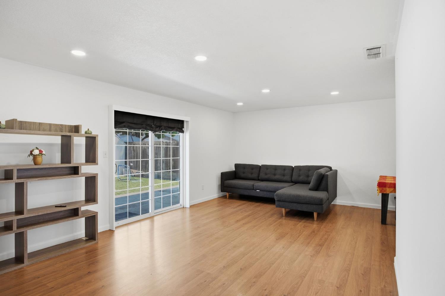1308 Basil Court Newman, CA 95360 - Photo 9 of 20 a living room with furniture and a wooden floor