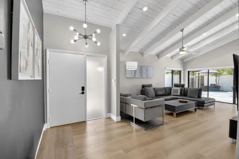 a living room with furniture and a large window