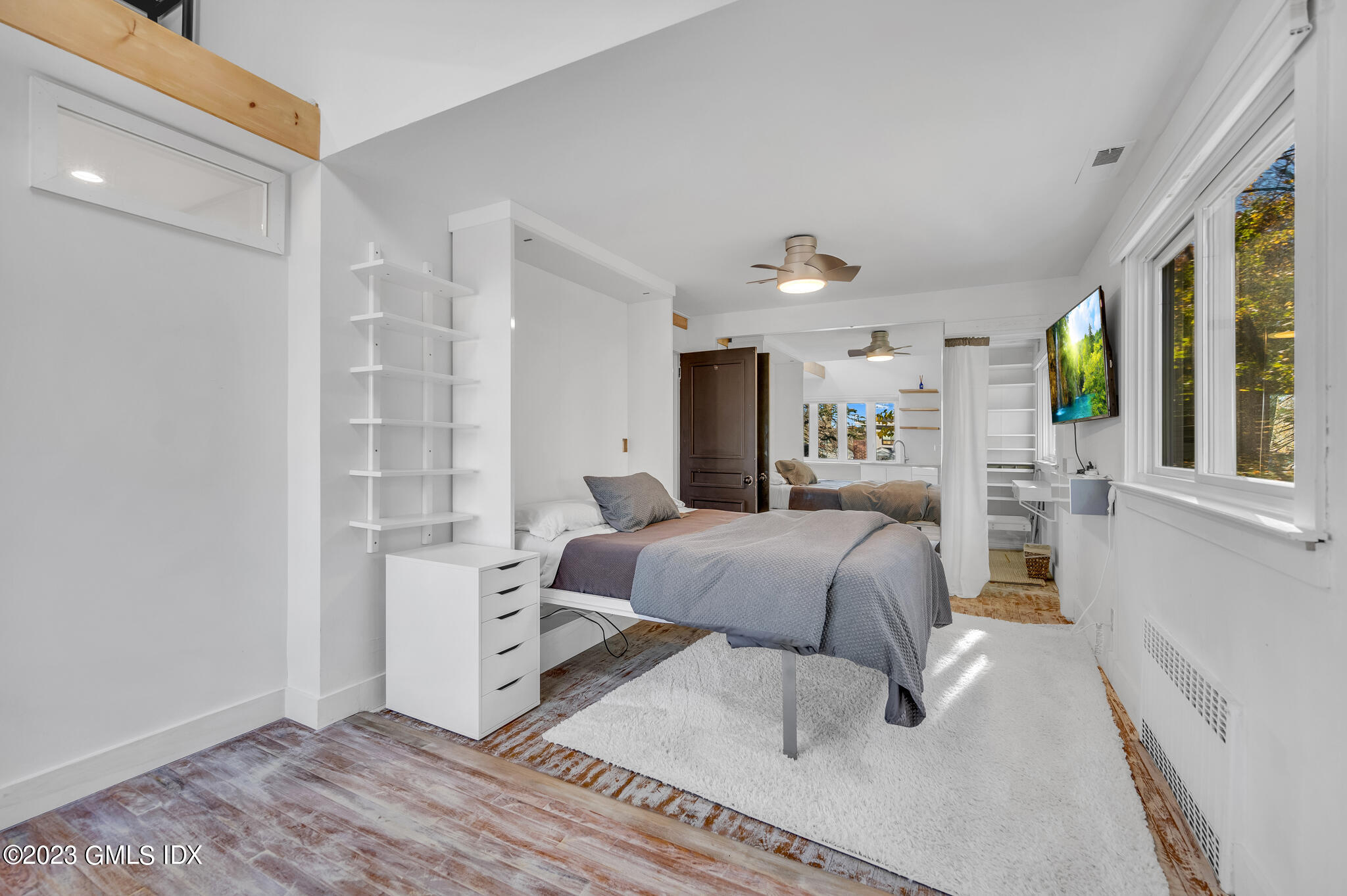 12 Taylor Drive Cos Cob, CT 06807 - Photo 12 of 21 a bedroom with a bed and wooden floor