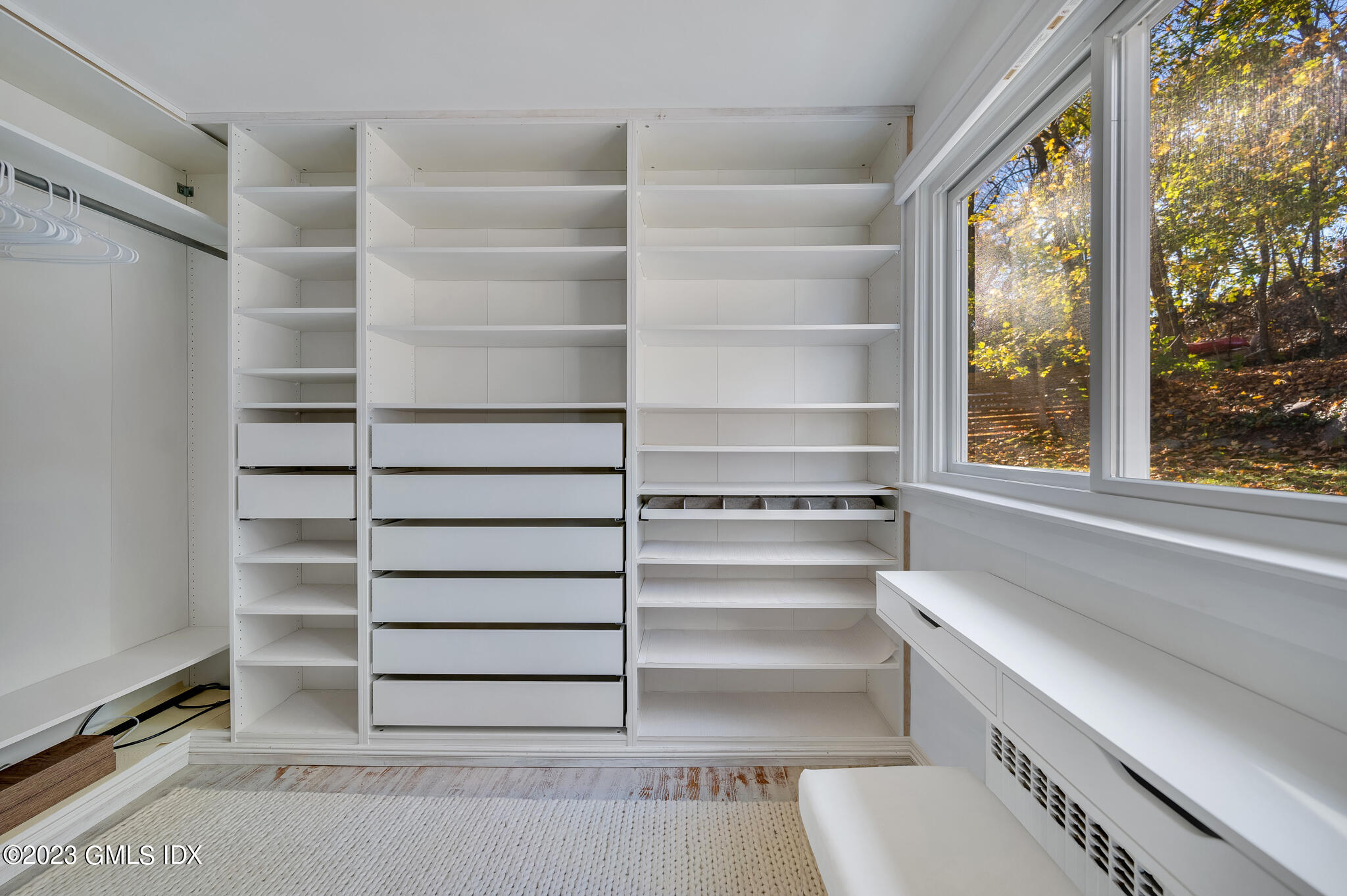 12 Taylor Drive Cos Cob, CT 06807 - Photo 13 of 21 a view of walk in closet with empty racks
