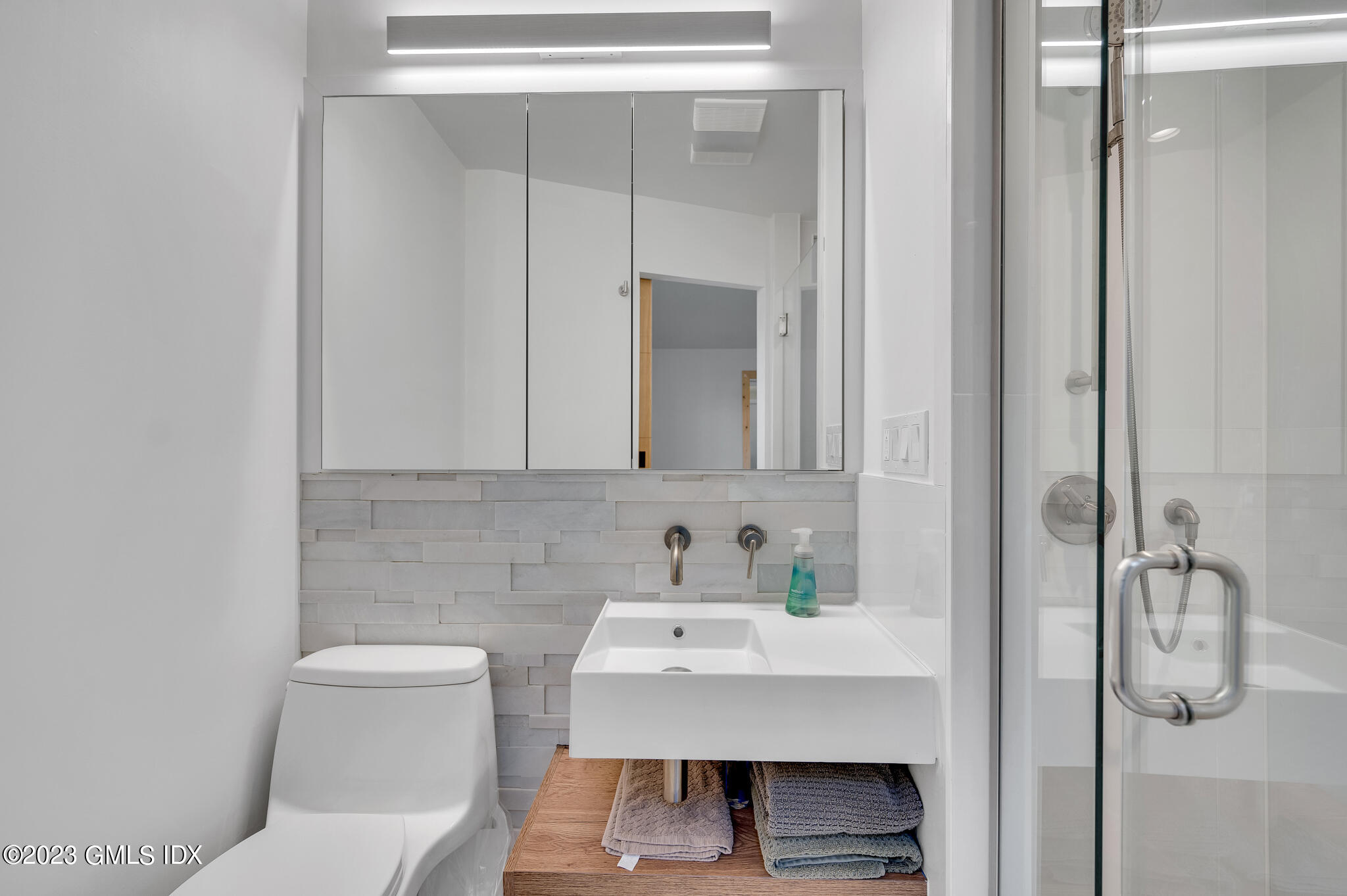 12 Taylor Drive Cos Cob, CT 06807 - Photo 14 of 21 a bathroom with a sink a toilet and mirror