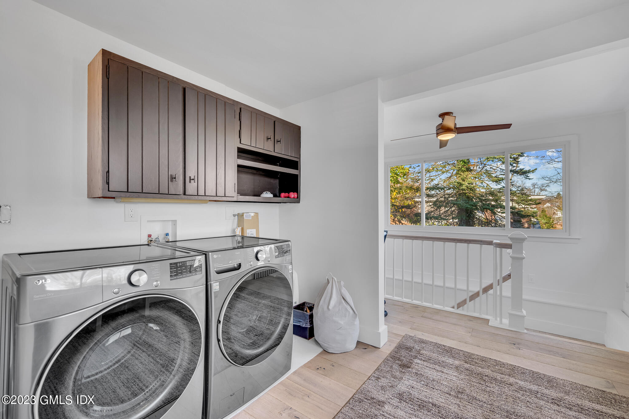 12 Taylor Drive Cos Cob, CT 06807 - Photo 17 of 21 a view of livingroom with washer and dryer