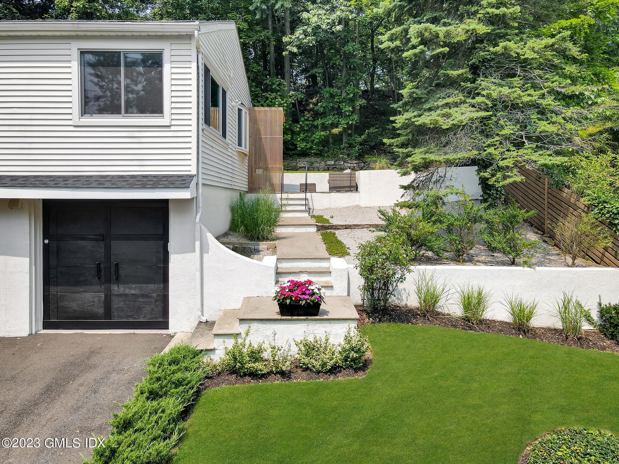 12 Taylor Drive Cos Cob, CT 06807 - Photo 2 of 21 a front view of a house with a yard