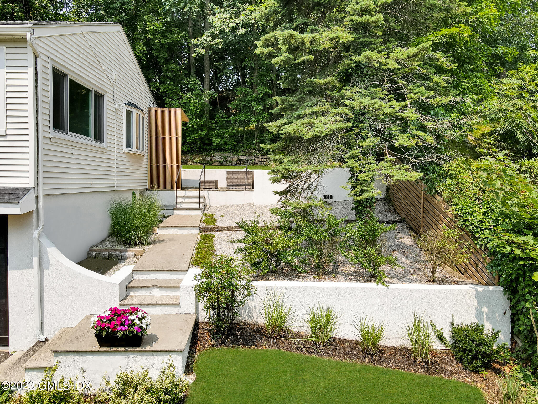 12 Taylor Drive Cos Cob, CT 06807 - Photo 3 of 21 a front view of a house with a yard