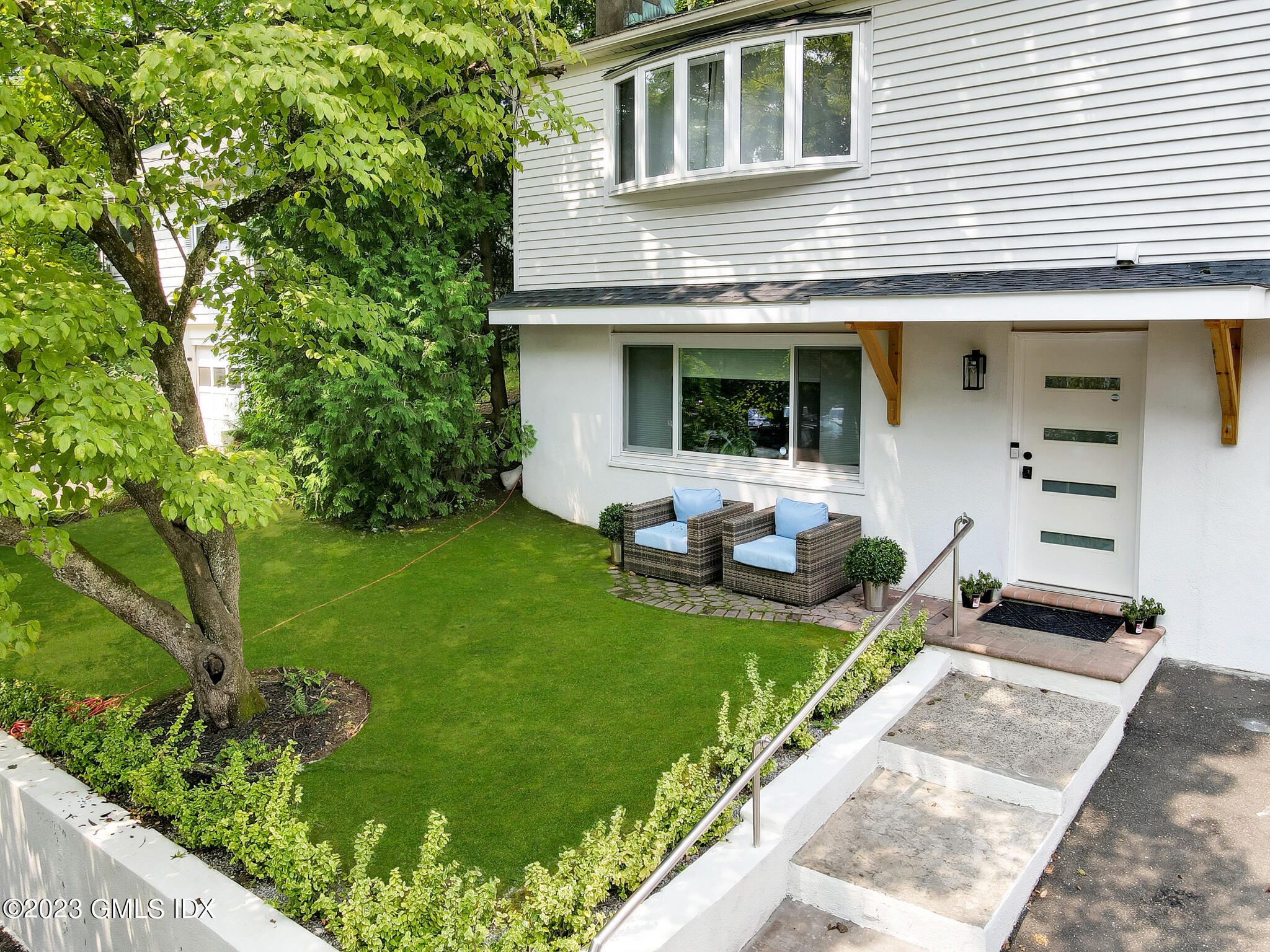 12 Taylor Drive Cos Cob, CT 06807 - Photo 4 of 21 a front view of a house with garden