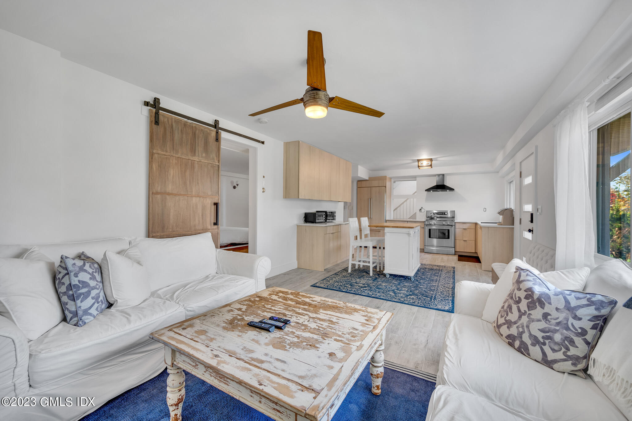 12 Taylor Drive Cos Cob, CT 06807 - Photo 7 of 21 a living room with furniture and kitchen view