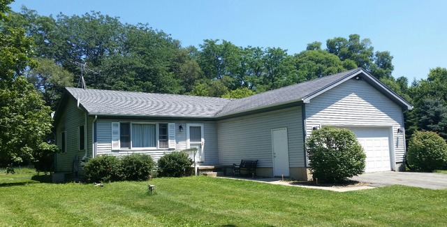 5N235 Hanson Road St. Charles, IL 60175 - Photo 1 of 17 a view of a house with a yard and plants