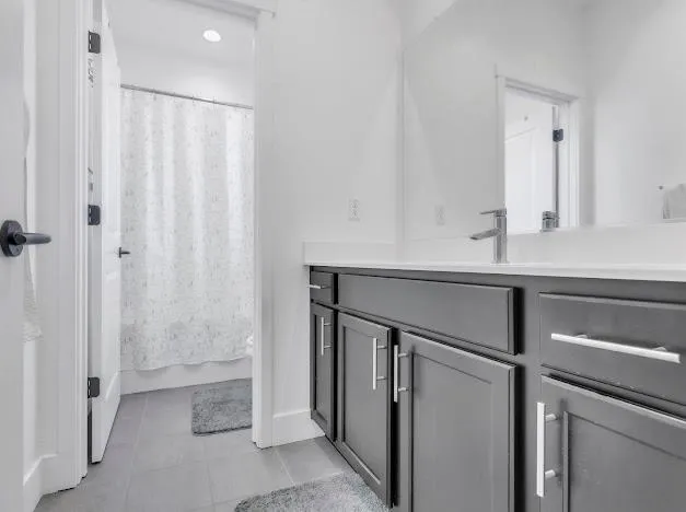 a room with a sink and a mirror