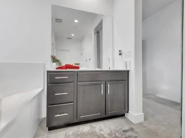 a utility room with cabinets and washer