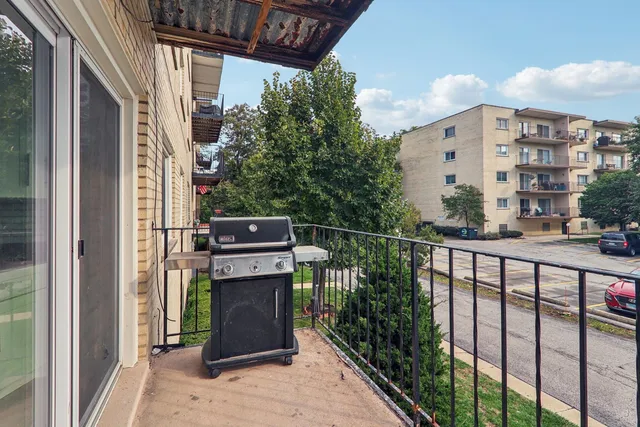 a view of a balcony with chairs