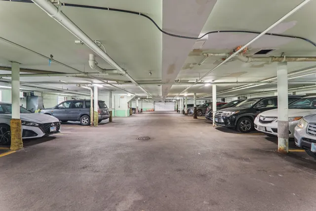 a view of parking garage with cars