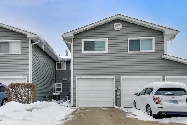 a front view of a house with parking space