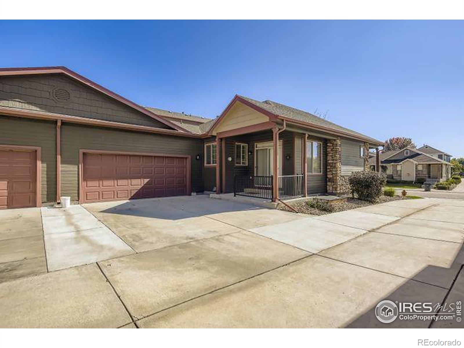 3453 Rhea Drive Loveland, CO 80537 - Photo 28 of 33 a front view of a house with a yard