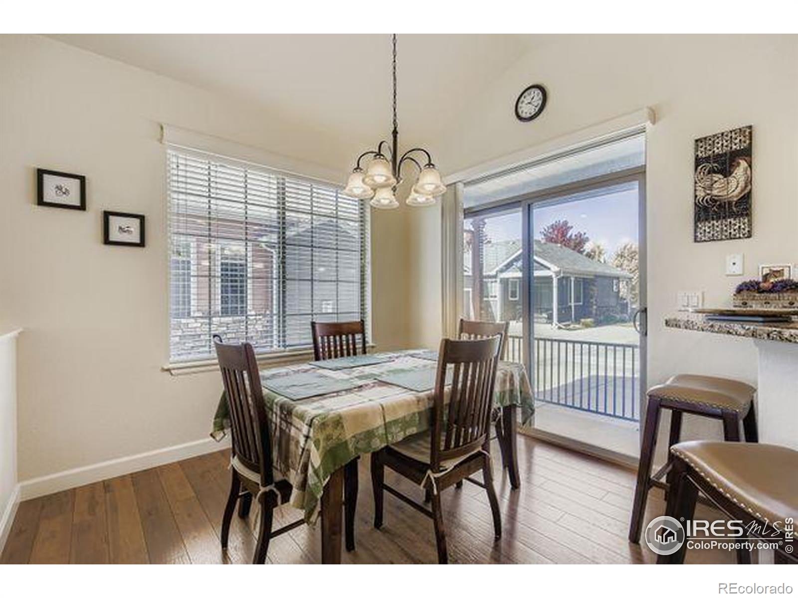 3453 Rhea Drive Loveland, CO 80537 - Photo 8 of 33 a view of a dining room with furniture and window