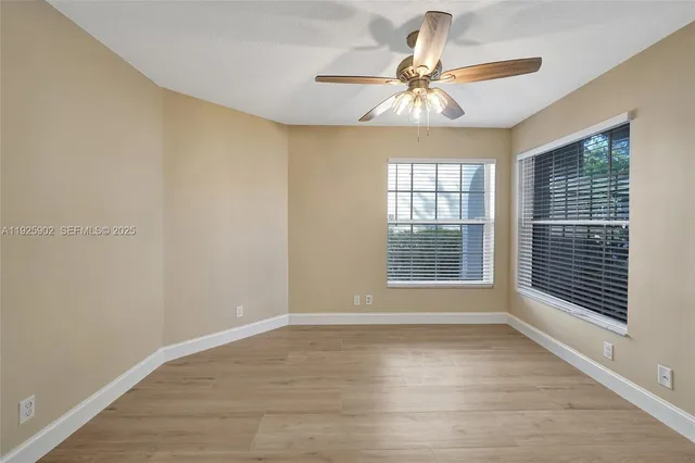 a view of an empty room with a window