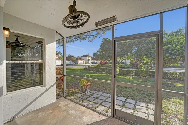 a view of a living room and a floor to ceiling window