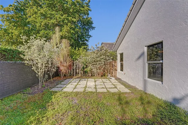 a view of a backyard of the house