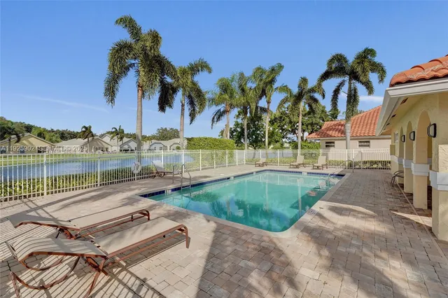 a view of a patio with a table and chairs