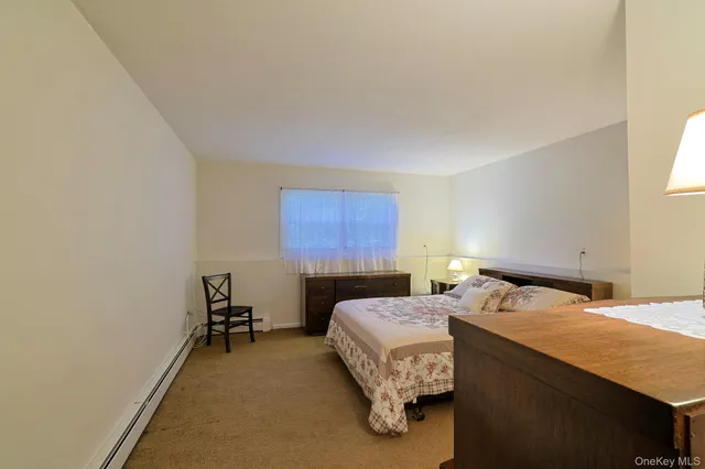 a bedroom with a bed and a table in it