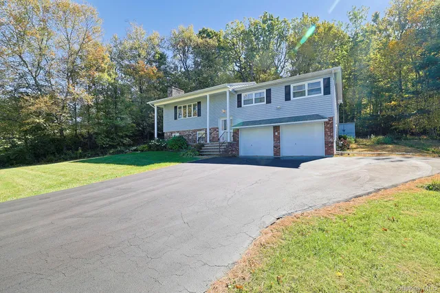 a house view with a backyard space