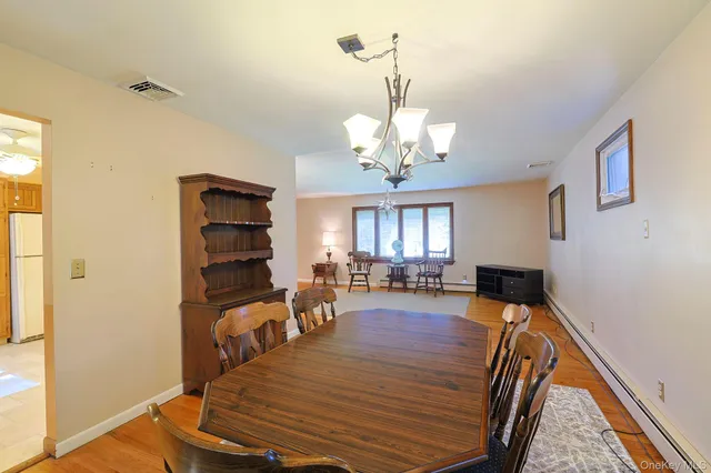 a view of a livingroom with furniture window and wooden floor