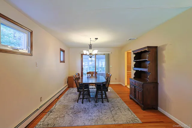 a dining room with furniture and window