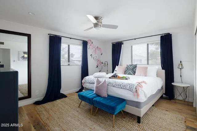 a spacious bedroom with a bed and a window