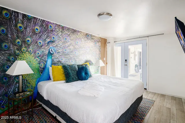 a bed room with a bed and a lamp