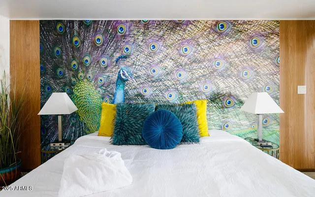 a bed room with a bed and a lamp