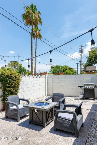 a view of patio with swimming pool