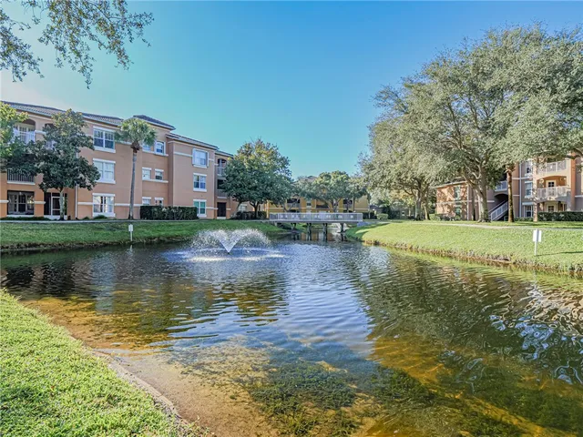 a view of a lake with a building in the background