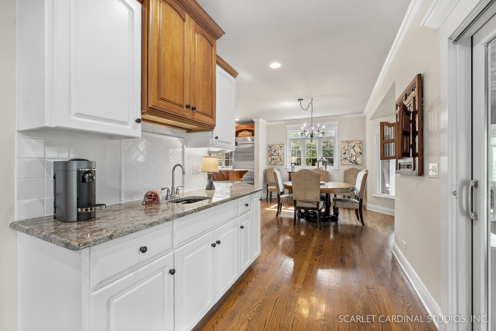 1736 Robert Lane Naperville, IL 60564 - Photo 24 of 82 a kitchen with stainless steel appliances granite countertop sink stove refrigerator dining table and chairs
