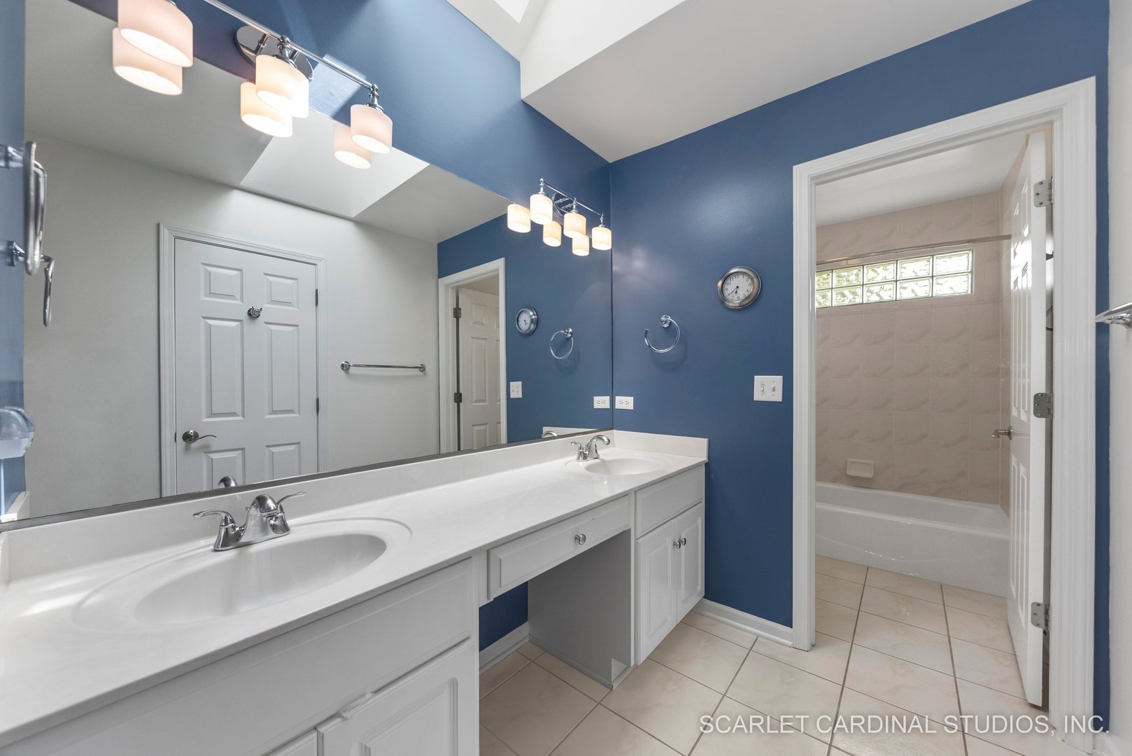 1736 Robert Lane Naperville, IL 60564 - Photo 46 of 82 a bathroom with a sink a vanity a mirror and a bathtub