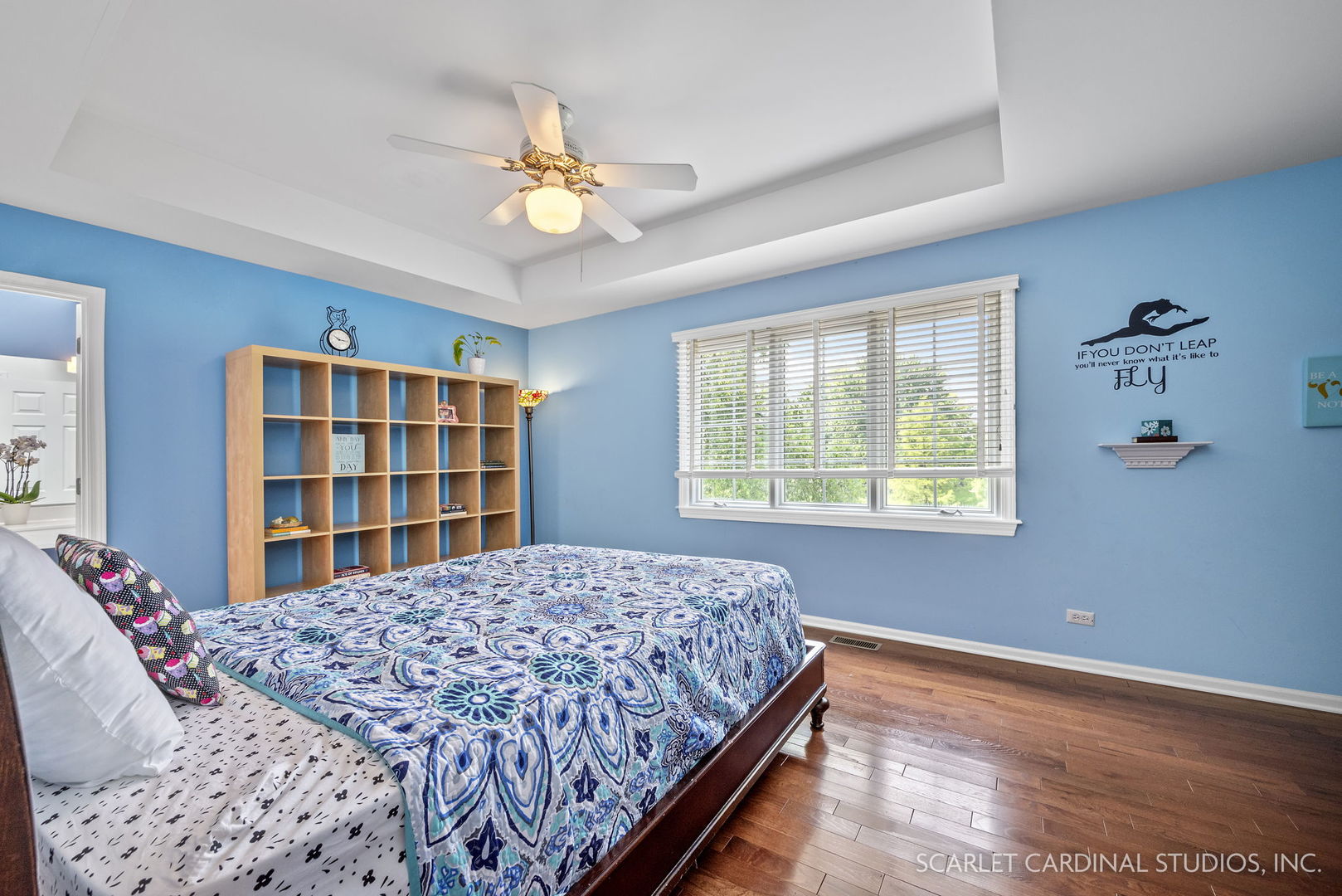 1736 Robert Lane Naperville, IL 60564 - Photo 47 of 82 a bedroom with a large bed and a chandelier