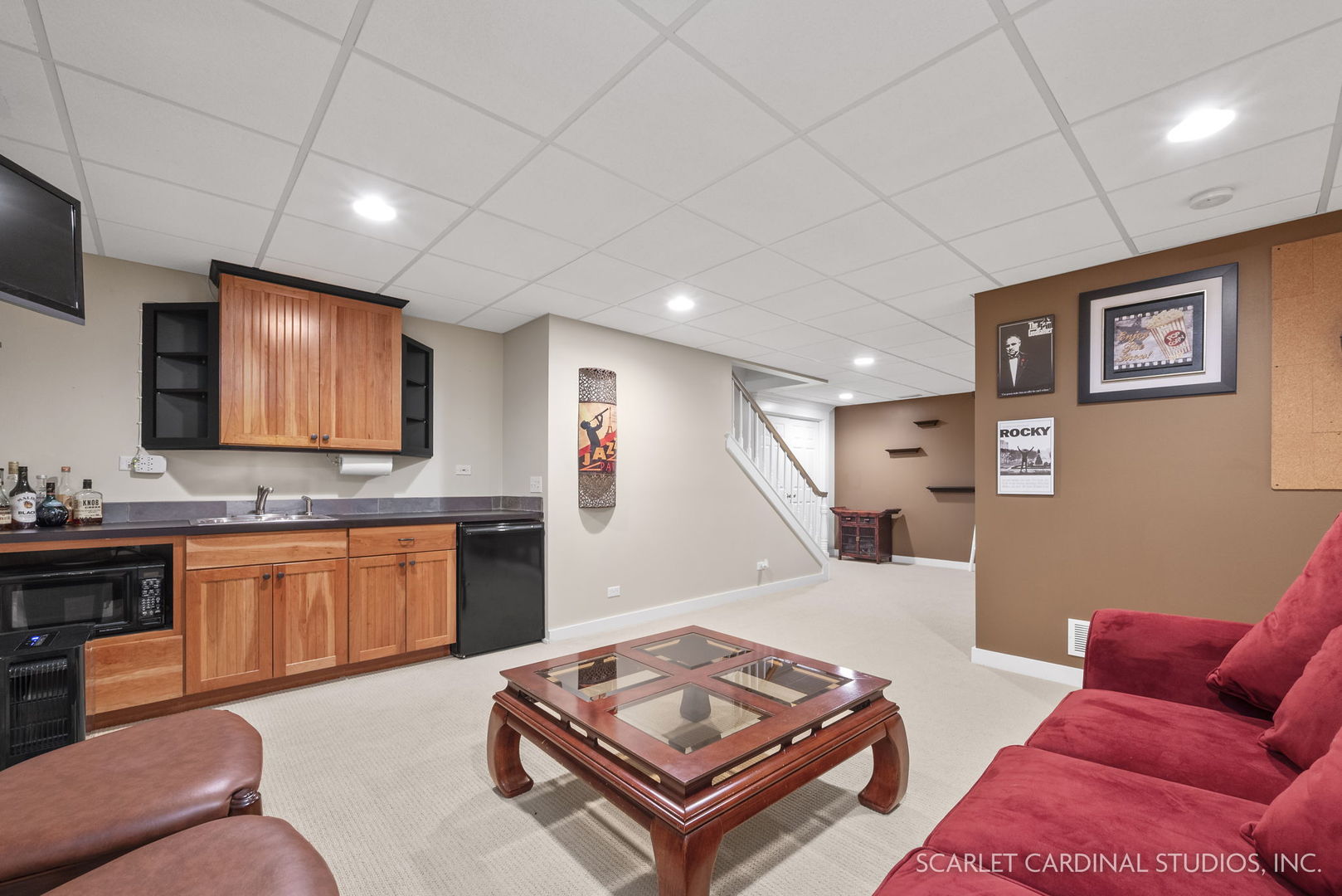 1736 Robert Lane Naperville, IL 60564 - Photo 50 of 82 a living room with furniture a flat screen tv and kitchen area