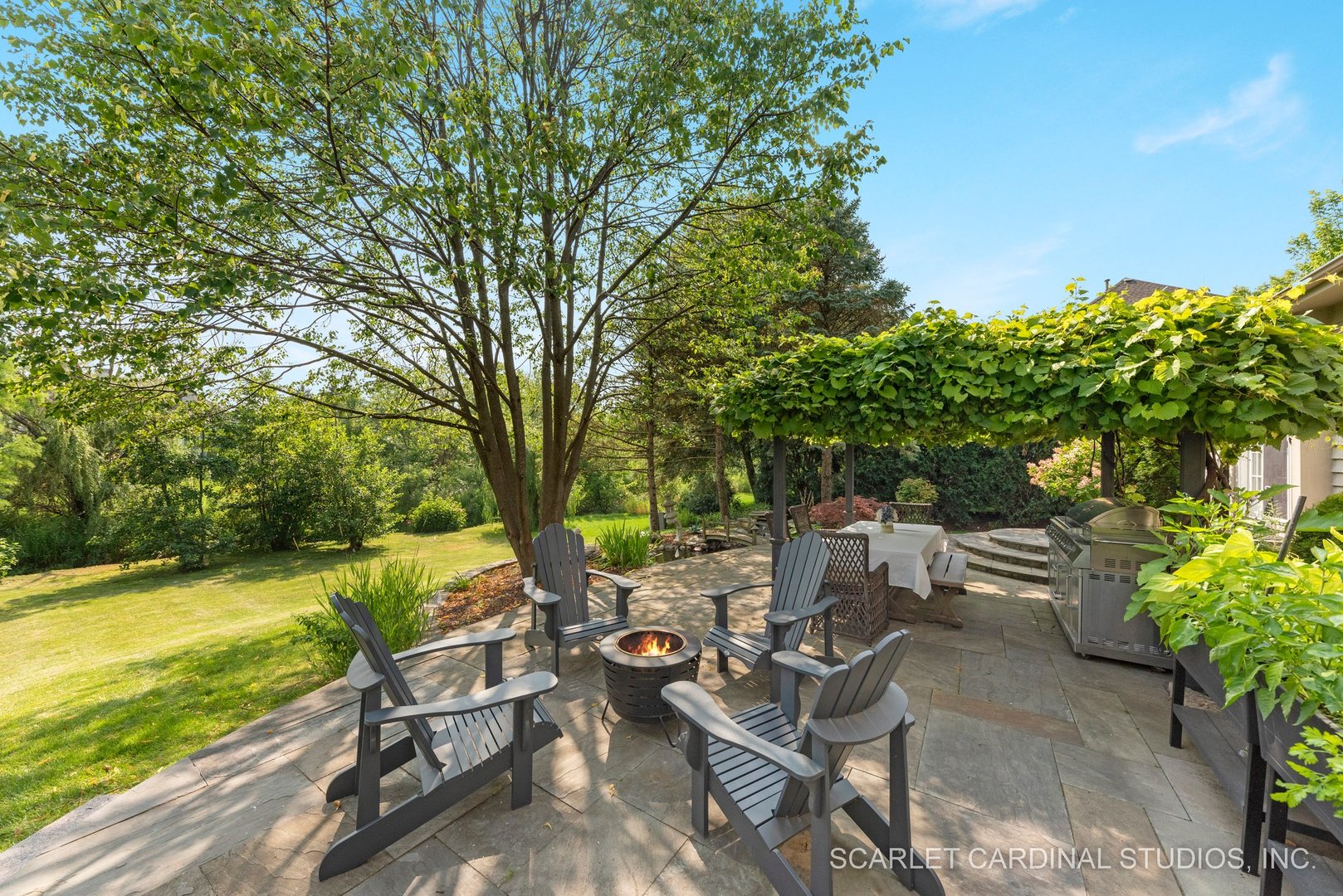 1736 Robert Lane Naperville, IL 60564 - Photo 61 of 82 a view of a patio with table and chairs and potted plants with large tree