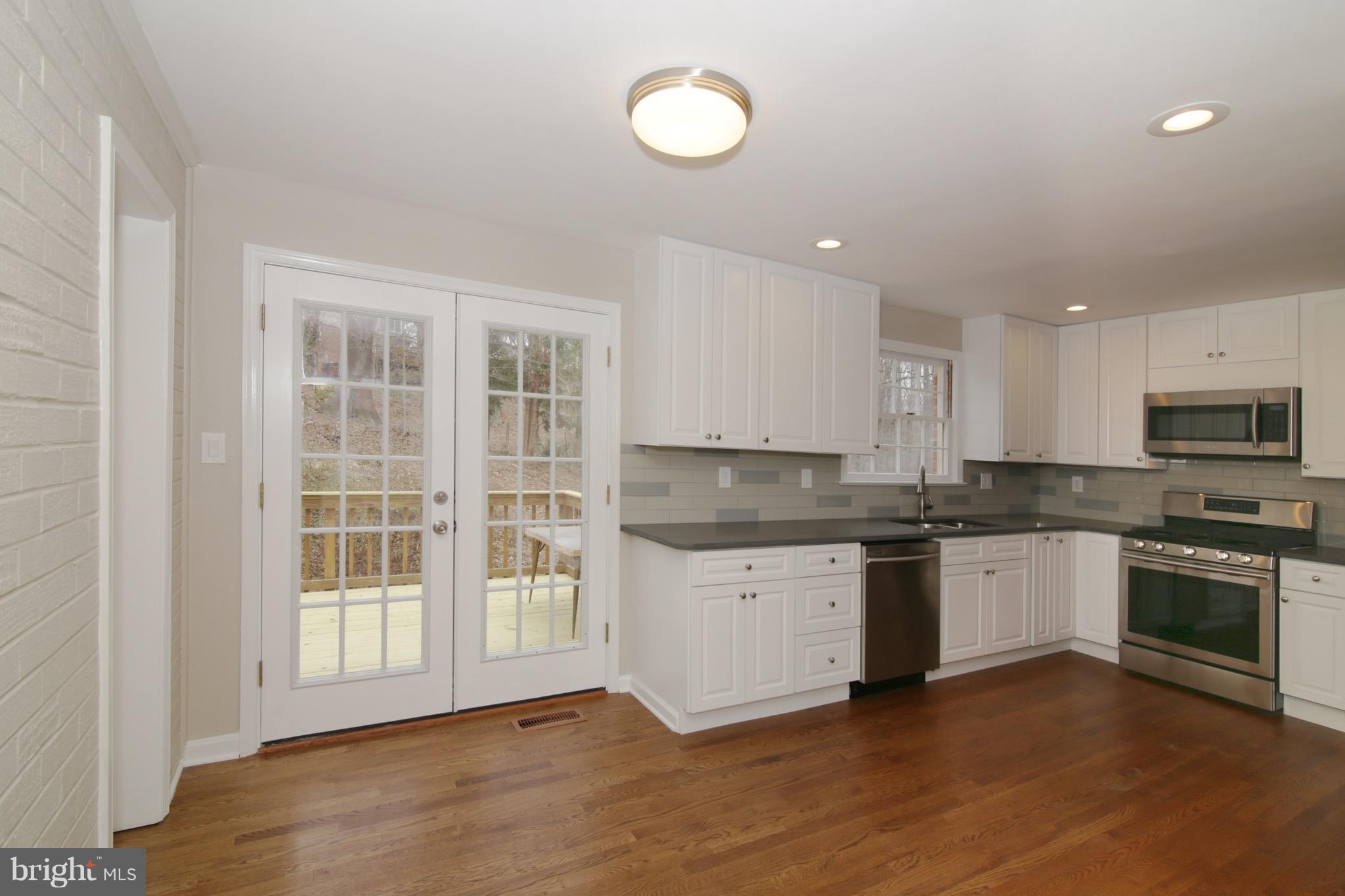 6700 Little Ann Court Springfield, VA 22152 - Photo 9 of 30 Kitchen with Atrium Doors to Deck