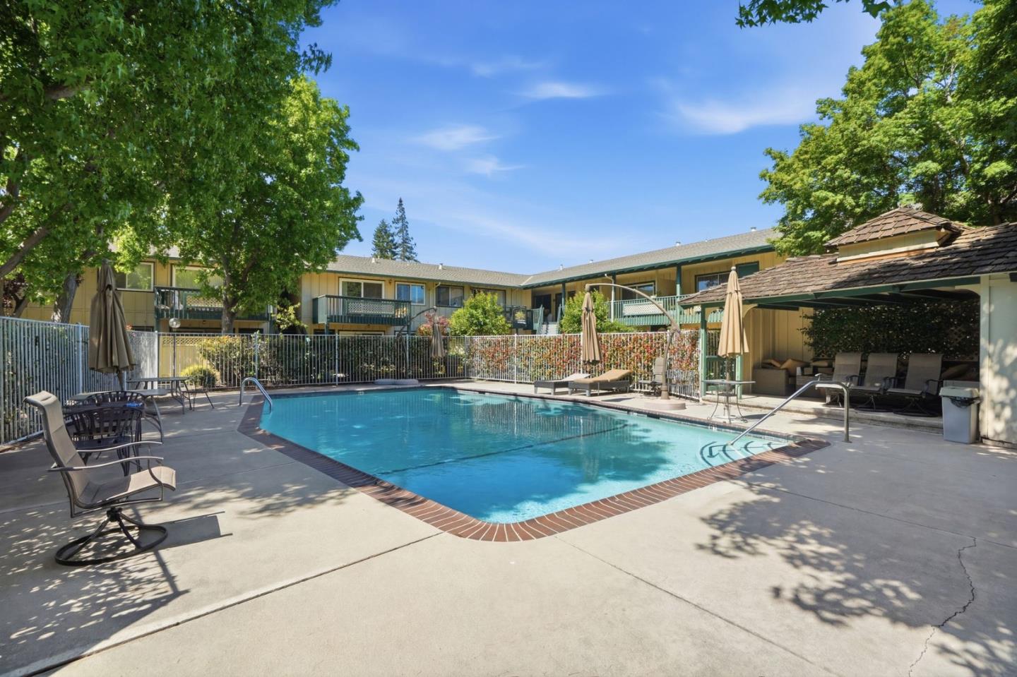2025 California Street, Unit 40 Mountain View, CA 94040 - Photo 26 of 31 a view of a house with swimming pool and sitting area