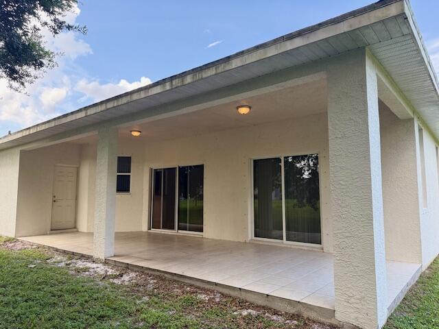 2619 Southwest Ann Arbor Road Port St. Lucie, FL 34953 - Photo 16 of 18 Back covered patio