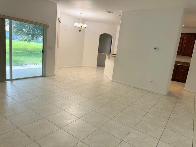 2619 Southwest Ann Arbor Road Port St. Lucie, FL 34953 - Photo 5 of 18 Family room to kitchen