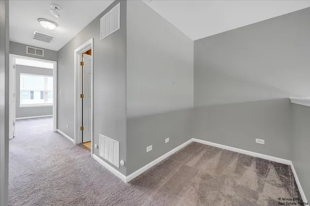 en empty room with windows