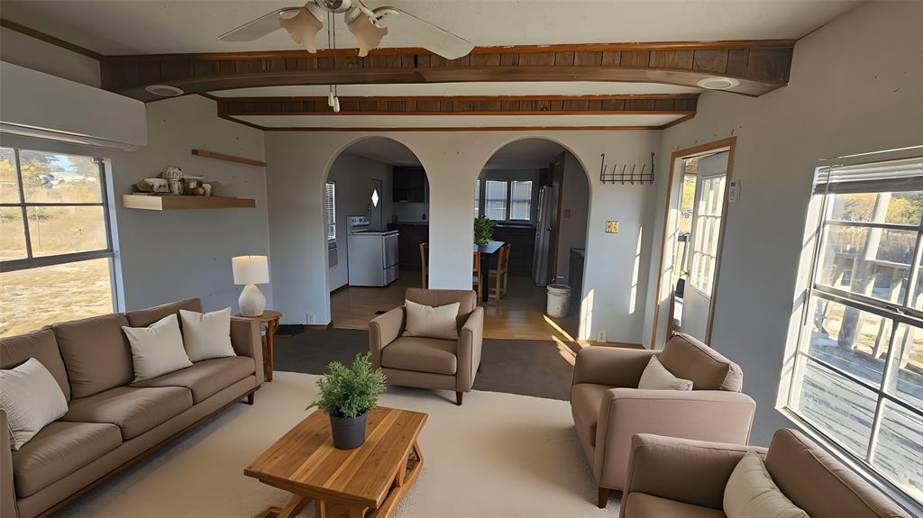 a living room with furniture and a window