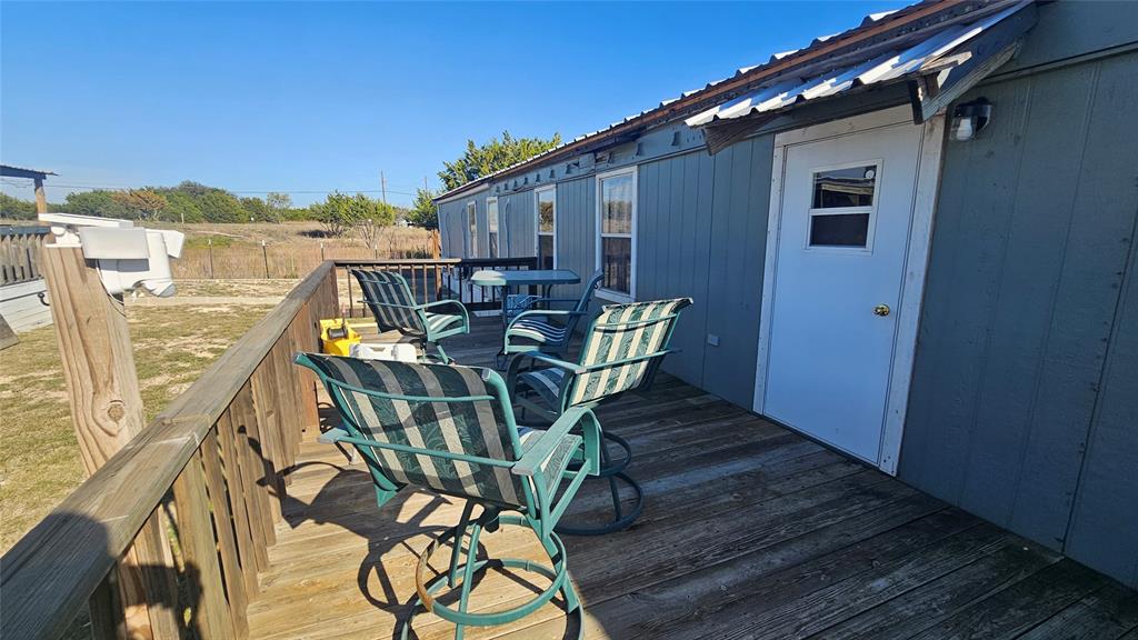 413 Lakeview Trail Weatherford, TX 76087 - Photo 12 of 40 a view of a balcony with table and chairs