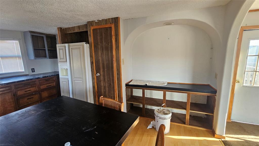 413 Lakeview Trail Weatherford, TX 76087 - Photo 30 of 40 a kitchen with stainless steel appliances a refrigerator and a sink